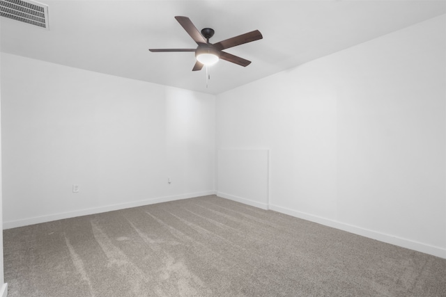 spare room with ceiling fan and carpet floors