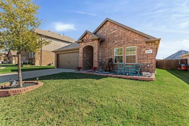 view of front of property with a front yard and a garage