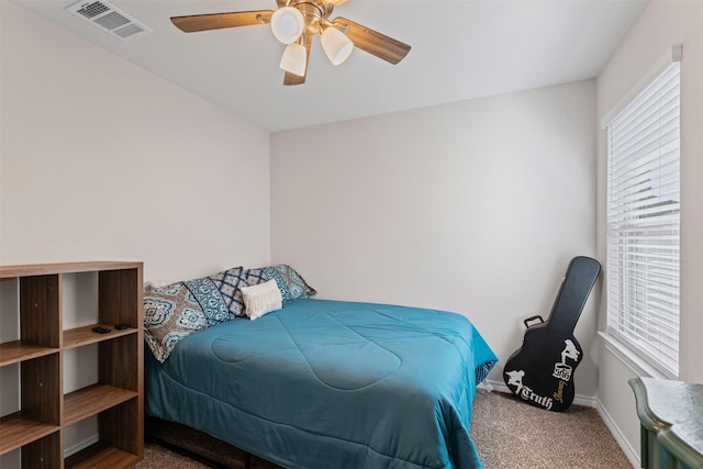 bedroom with ceiling fan and carpet