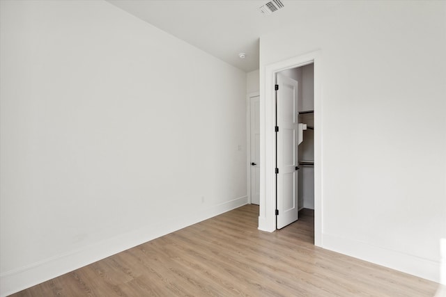 unfurnished bedroom featuring light wood-type flooring