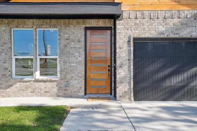 property entrance featuring a garage