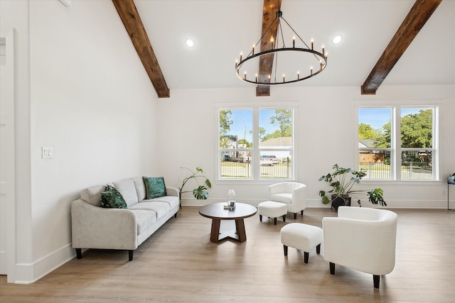 living room with a notable chandelier, vaulted ceiling with beams, and light wood-type flooring