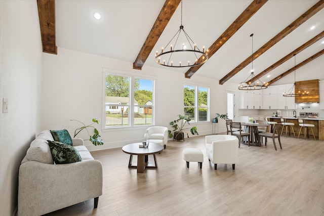 living room with light hardwood / wood-style flooring, beamed ceiling, and high vaulted ceiling