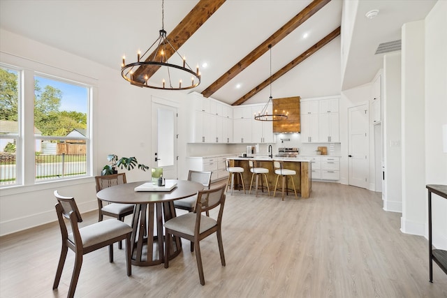 dining room with a chandelier, beam ceiling, light wood-type flooring, and high vaulted ceiling