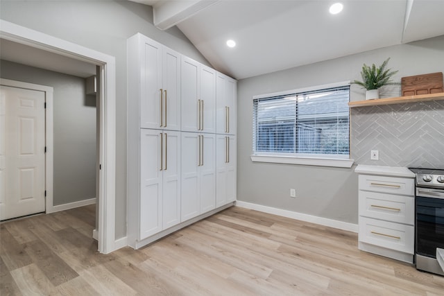 kitchen with decorative backsplash, stainless steel electric stove, light hardwood / wood-style flooring, vaulted ceiling with beams, and white cabinetry