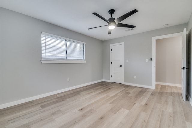 unfurnished bedroom featuring ceiling fan and light wood-type flooring