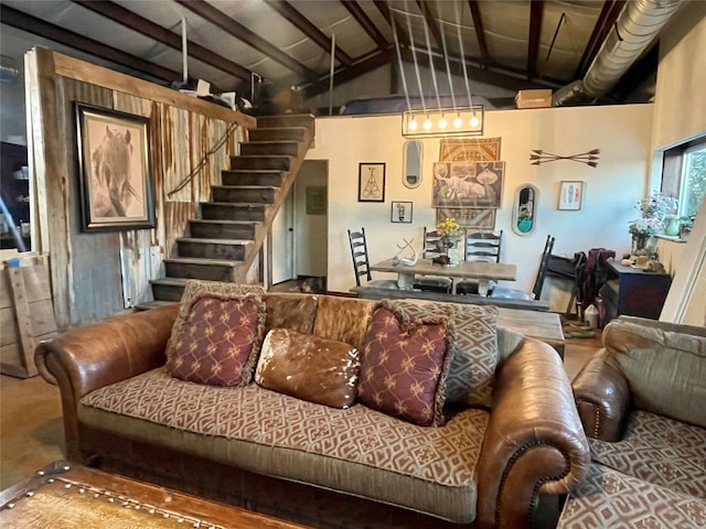 living room featuring beamed ceiling and high vaulted ceiling