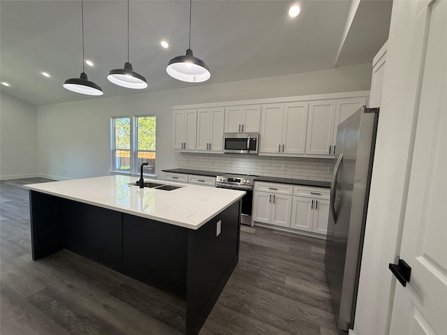 3210 Houston St, Greenville, TX 75401 - kitchen with decorative backsplash, stainless steel appliances, dark wood-style floors, and a sink