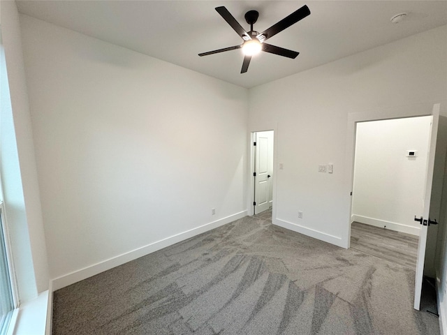 3210 Houston St, Greenville, TX 75401 - unfurnished bedroom with carpet floors, baseboards, and ceiling fan