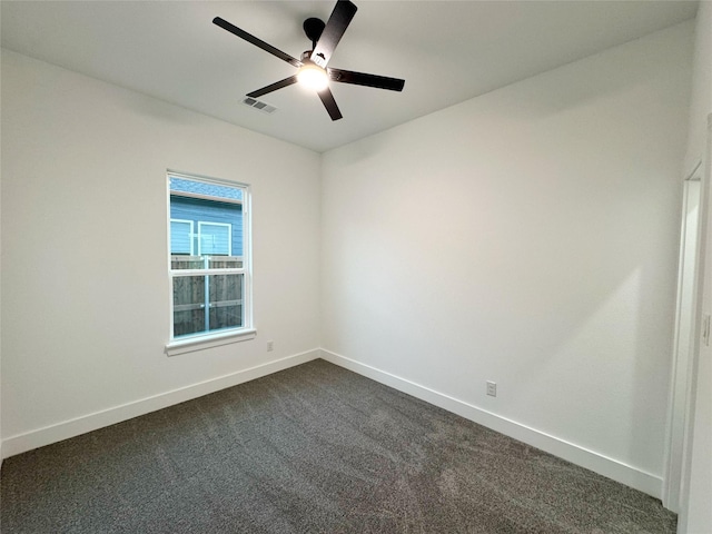 3210 Houston St, Greenville, TX 75401 - spare room with dark colored carpet, visible vents, baseboards, and ceiling fan
