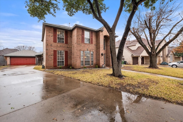 view of front of property with a garage and a front yard