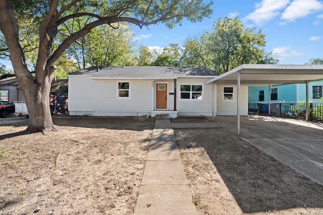 ranch-style home with a carport