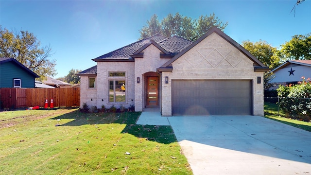 view of front facade with a front lawn and a garage