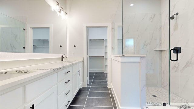 bathroom with vanity, tile patterned floors, and walk in shower