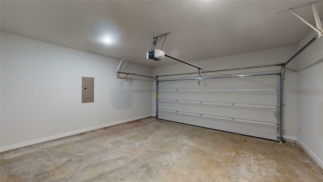 garage featuring electric panel and a garage door opener