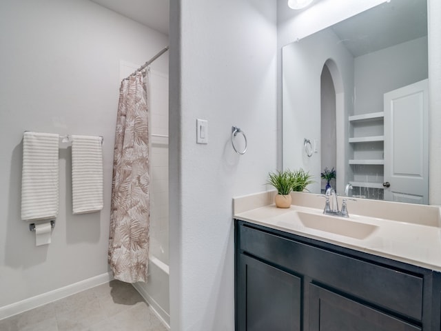 bathroom with vanity, tile patterned flooring, and shower / bath combination with curtain