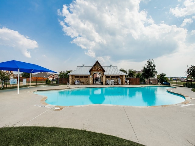 view of swimming pool with a patio area