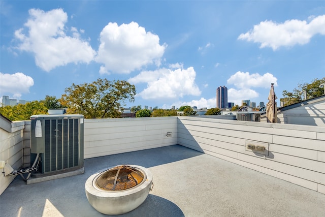 view of patio / terrace featuring central AC and an outdoor fire pit