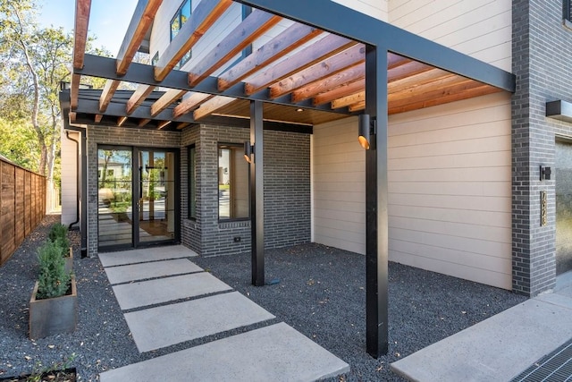 view of patio / terrace featuring a pergola and french doors