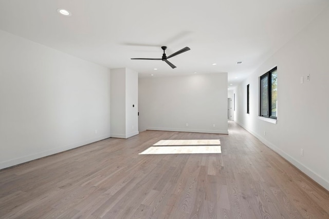 unfurnished room featuring ceiling fan and light wood-type flooring