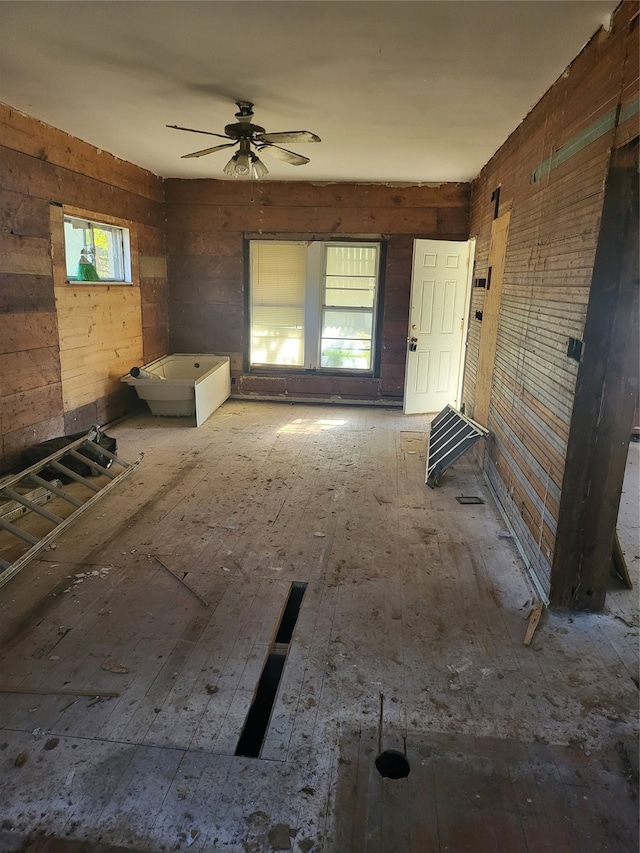 unfurnished room featuring wood-type flooring and ceiling fan