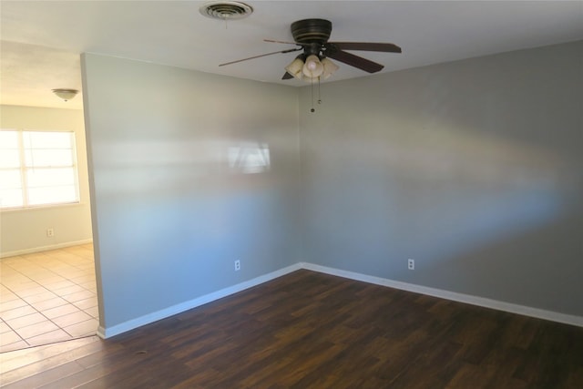 unfurnished room featuring ceiling fan and hardwood / wood-style flooring