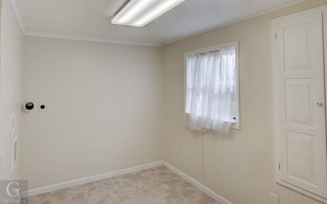 spare room with crown molding