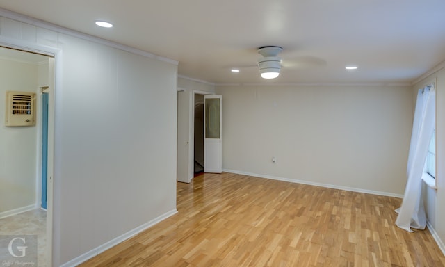 empty room with light hardwood / wood-style floors, ceiling fan, and ornamental molding