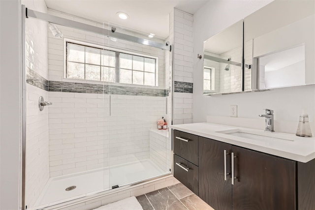 bathroom with vanity and walk in shower