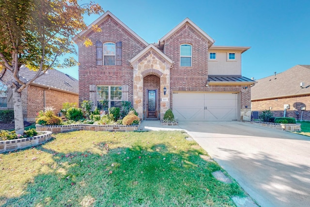 view of front of house with a front yard and a garage