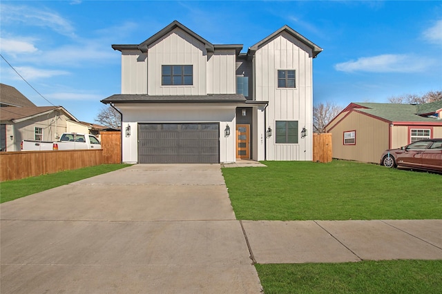 view of front of property featuring a garage and a front lawn