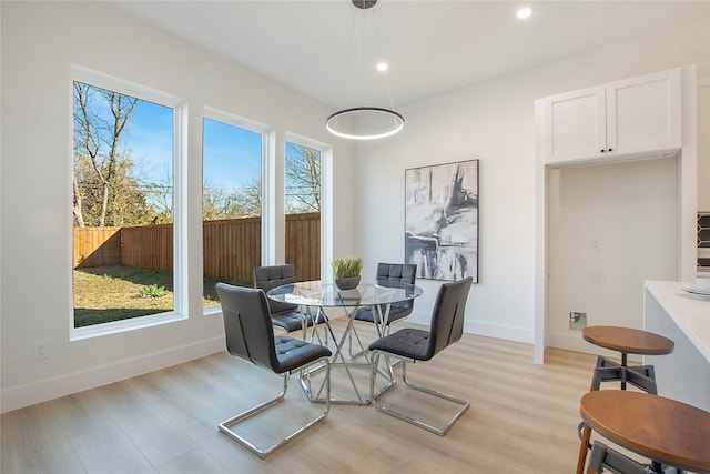 dining space with light wood-type flooring