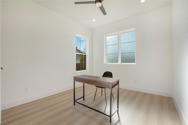 office featuring ceiling fan and light hardwood / wood-style flooring