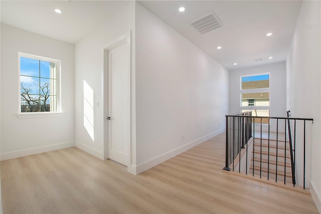 corridor featuring light hardwood / wood-style flooring