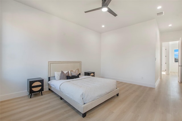 bedroom featuring ceiling fan and light hardwood / wood-style flooring