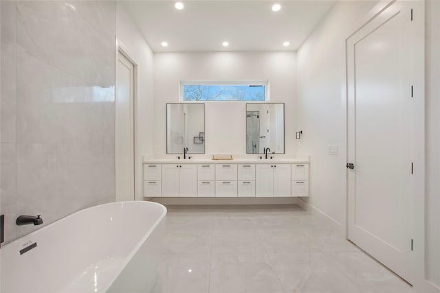 bathroom with vanity and separate shower and tub