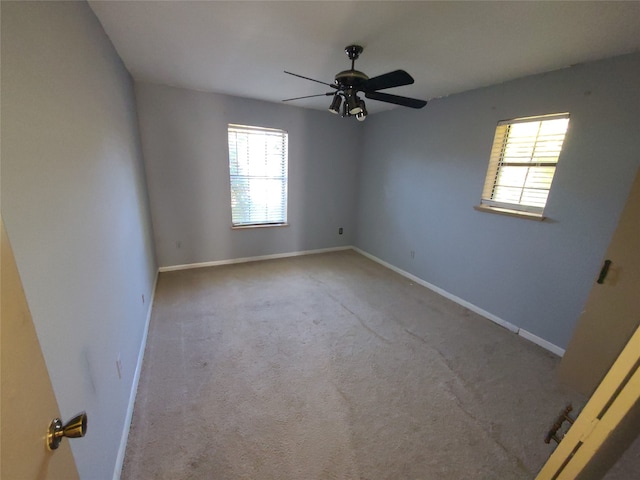 unfurnished room featuring carpet and ceiling fan