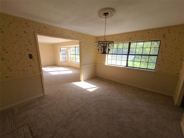 unfurnished dining area with carpet flooring and a notable chandelier