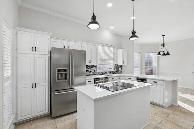 1920 Templehill Dr, Plano, TX 75075 - kitchen with appliances with stainless steel finishes, a sink, a peninsula, white cabinetry, and ornamental molding