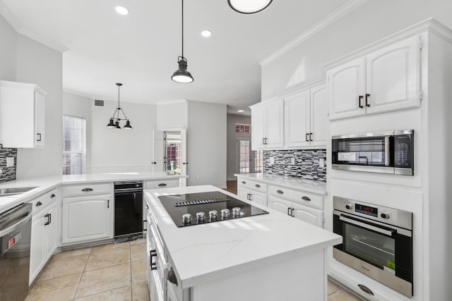 1920 Templehill Dr, Plano, TX 75075 - kitchen featuring appliances with stainless steel finishes, backsplash, ornamental molding, a center island, and white cabinets