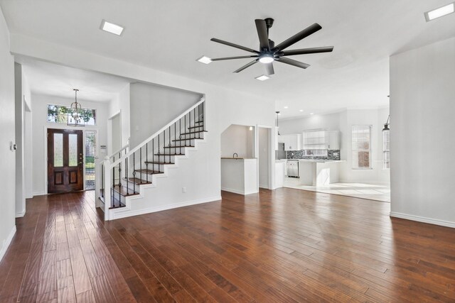 1920 Templehill Dr, Plano, TX 75075 - foyer entrance featuring a chandelier, baseboards, dark wood-type flooring, stairway, and ceiling fan
