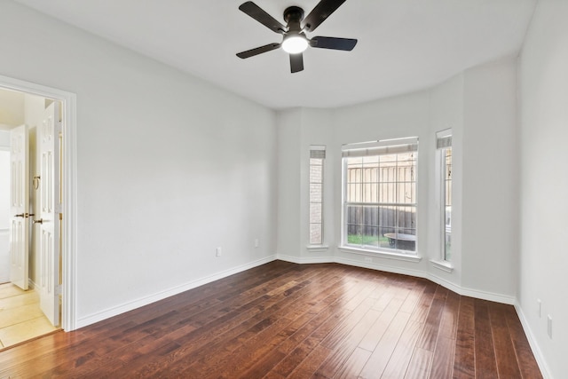 1920 Templehill Dr, Plano, TX 75075 - empty room featuring dark wood-style flooring, ceiling fan, and baseboards