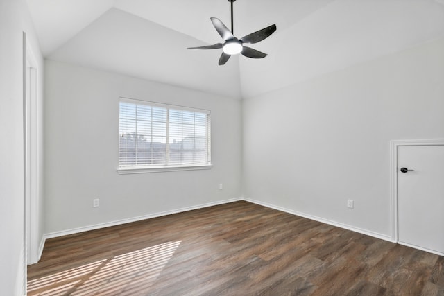 spare room with dark wood-type flooring, ceiling fan, and lofted ceiling