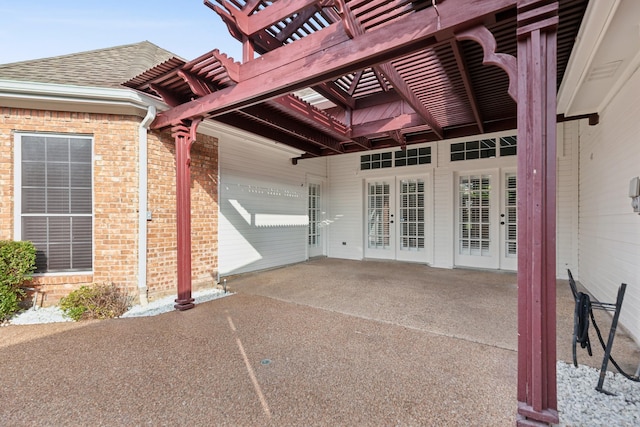 property entrance featuring a pergola and a patio area