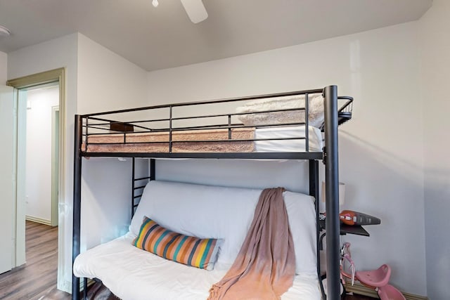 bedroom featuring hardwood / wood-style floors and ceiling fan