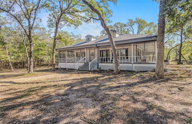 view of front of house with a sunroom