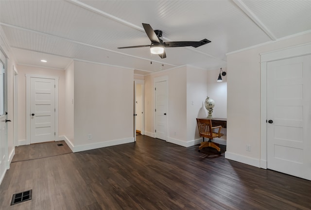 empty room featuring dark hardwood / wood-style floors, ceiling fan, and crown molding