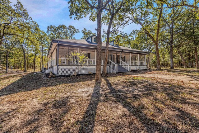 view of front of house with a sunroom