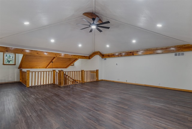 bonus room featuring lofted ceiling with beams, ceiling fan, and dark wood-type flooring