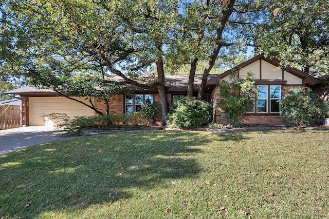 ranch-style home featuring a garage and a front lawn